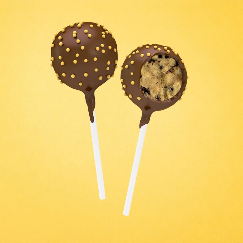 A  sweet buttery naturally flavored vanilla cake with chocolate chips dipped in milk and dark chocolates.