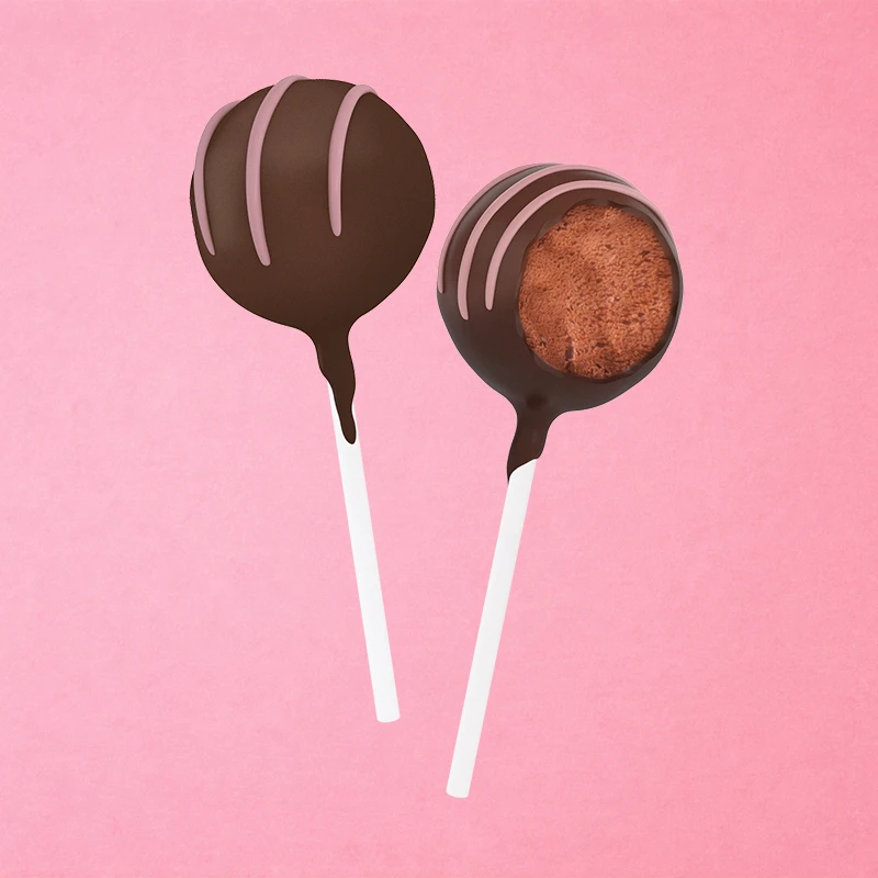 A moist strawberry-infused cake encased in a smooth, rich chocolate coating, drizzled with pink colored white chocolate.